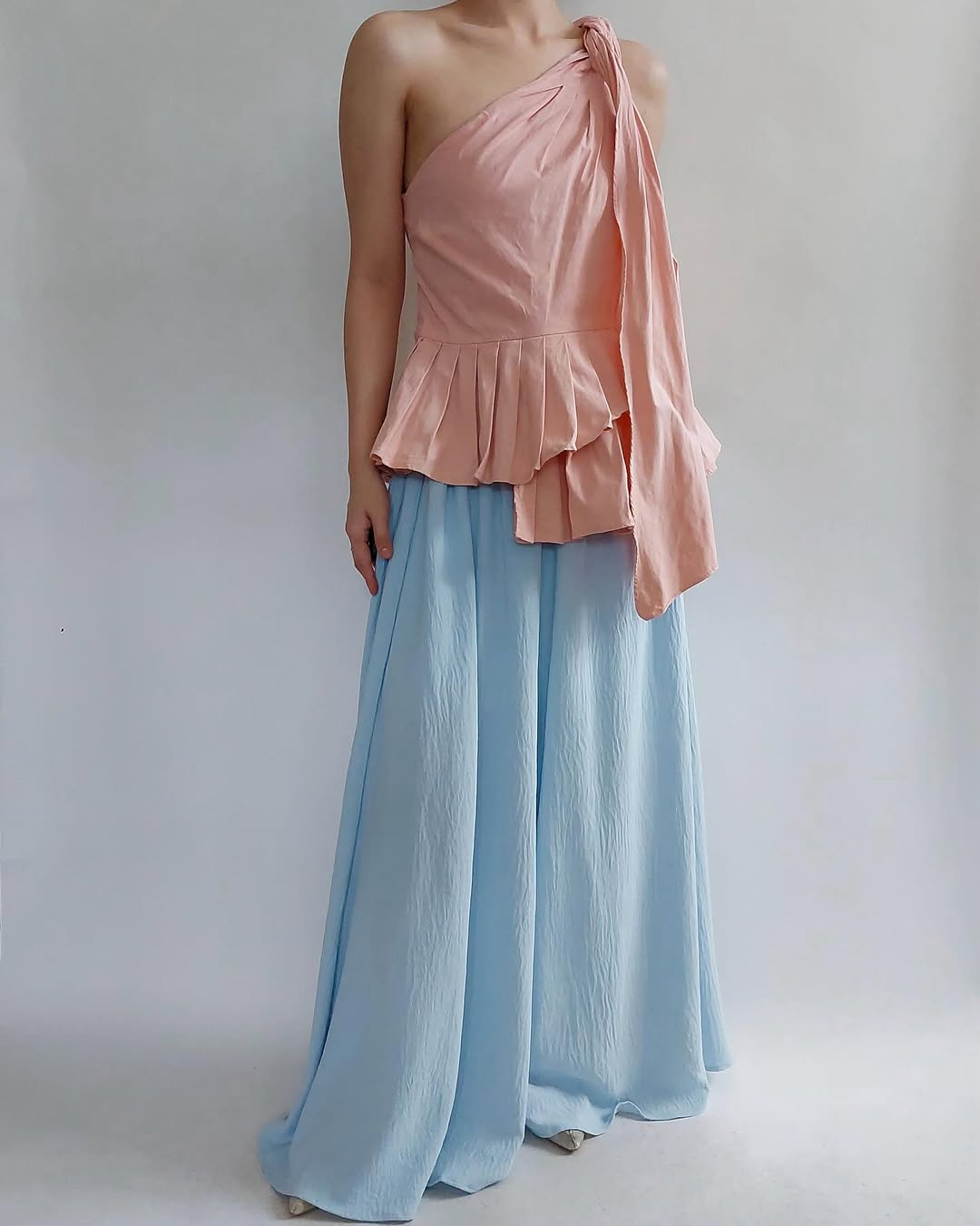 Peach one shoulder pleated top